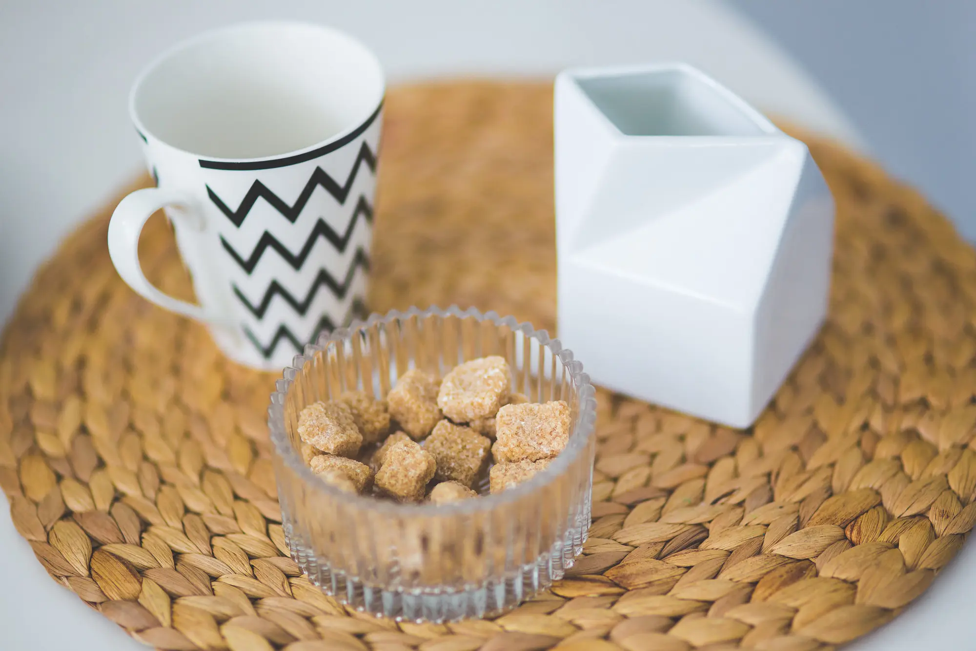 Patterned ceramic mug on a woven placemat